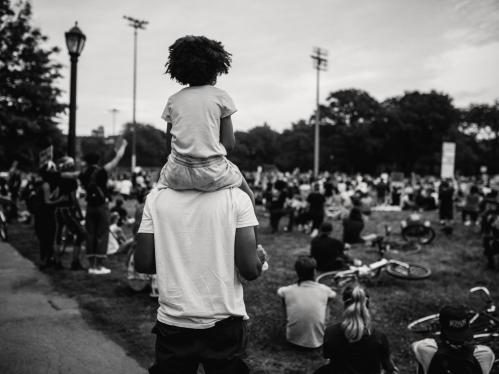 Man with child on shoulders